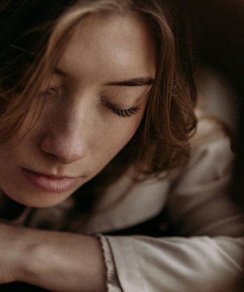 Portrait of Olga Zarichna, a wellness professional with a confident smile.